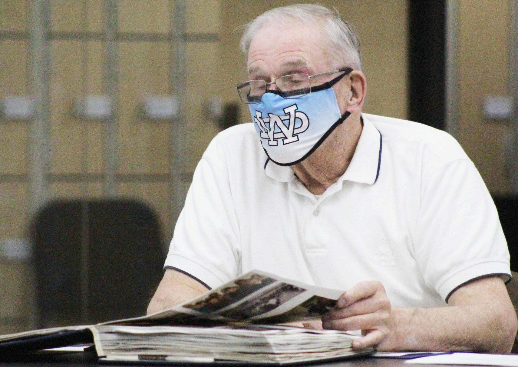 Bob flips through scrapbook